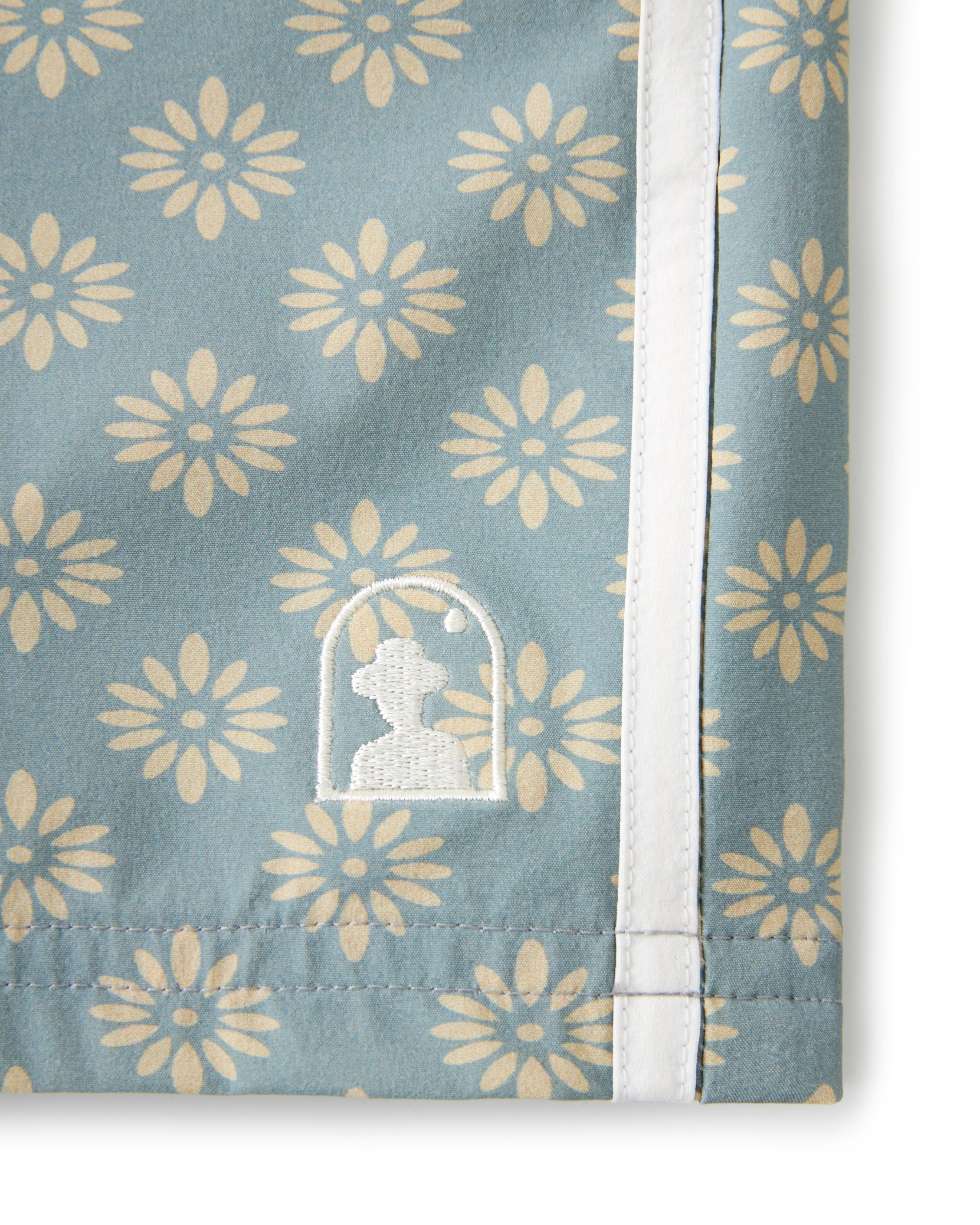A blue towel with a floral design.
Product: The Stirata Swim Short - Abalone
Brand: Dandy Del Mar