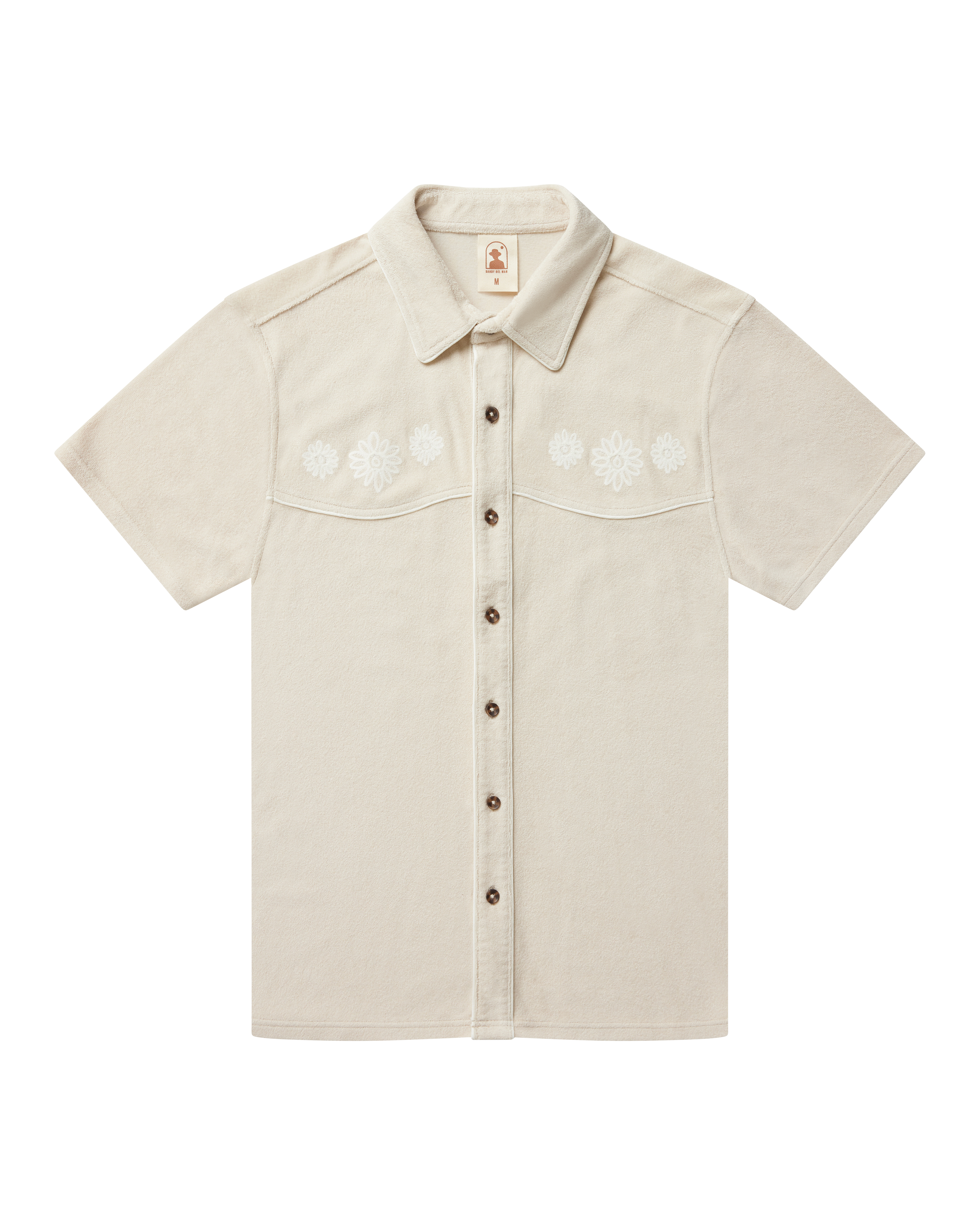 The Gaucho Shirt - Alabaster by Dandy Del Mar features short sleeves, a pointed collar, and subtle white floral embroidery—perfect for channeling your inner Equatorial Cowboy.
