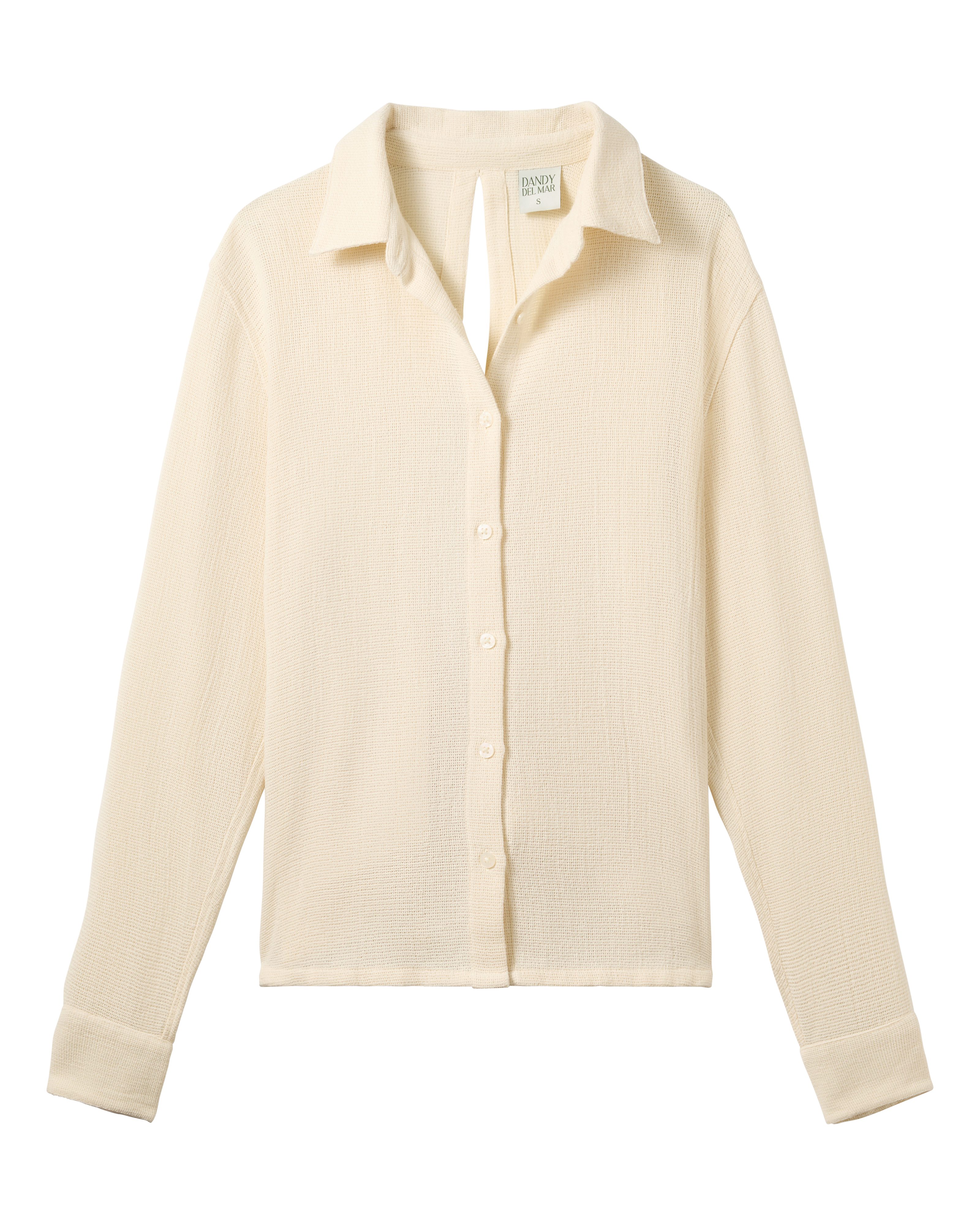 The Sevilla Top - Scallop by Dandy Del Mar is a cream, long-sleeved, collared button-up shirt shown flat on a black background.