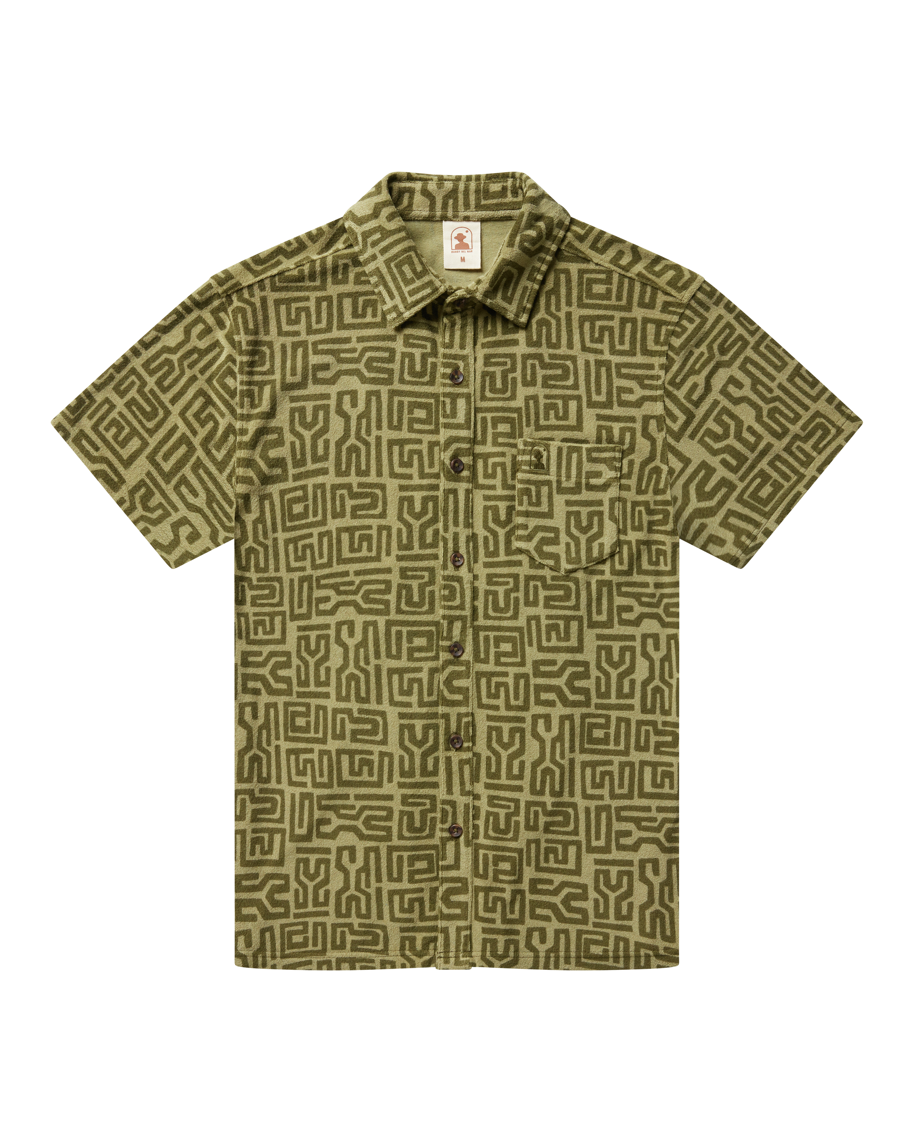 The Tropez Shirt - Berdea Tayana Print by Dandy Del Mar features short sleeves, an olive-green geometric pattern, a front pocket, and premium terry cloth, shown against a plain black background.