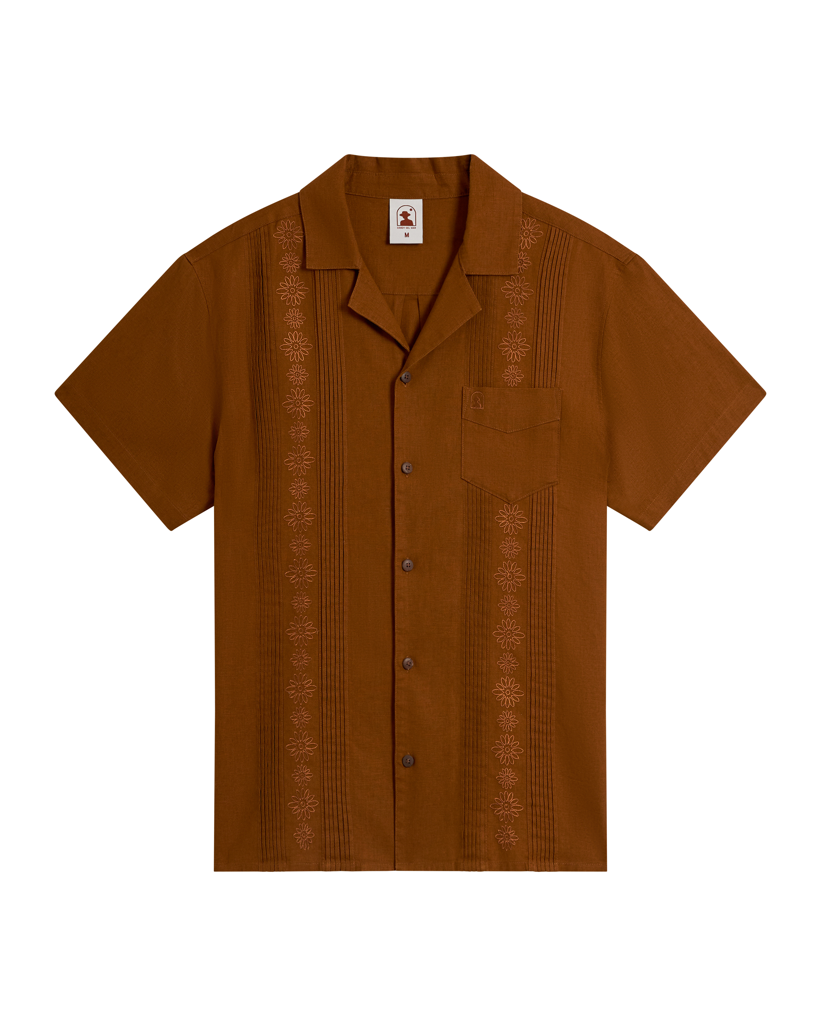 The Brisa Linen Shirt - Sedona by Dandy Del Mar is a short-sleeve brown linen shirt featuring coconut shell buttons, embroidered vertical patterns, and a single chest pocket, displayed on a plain background.