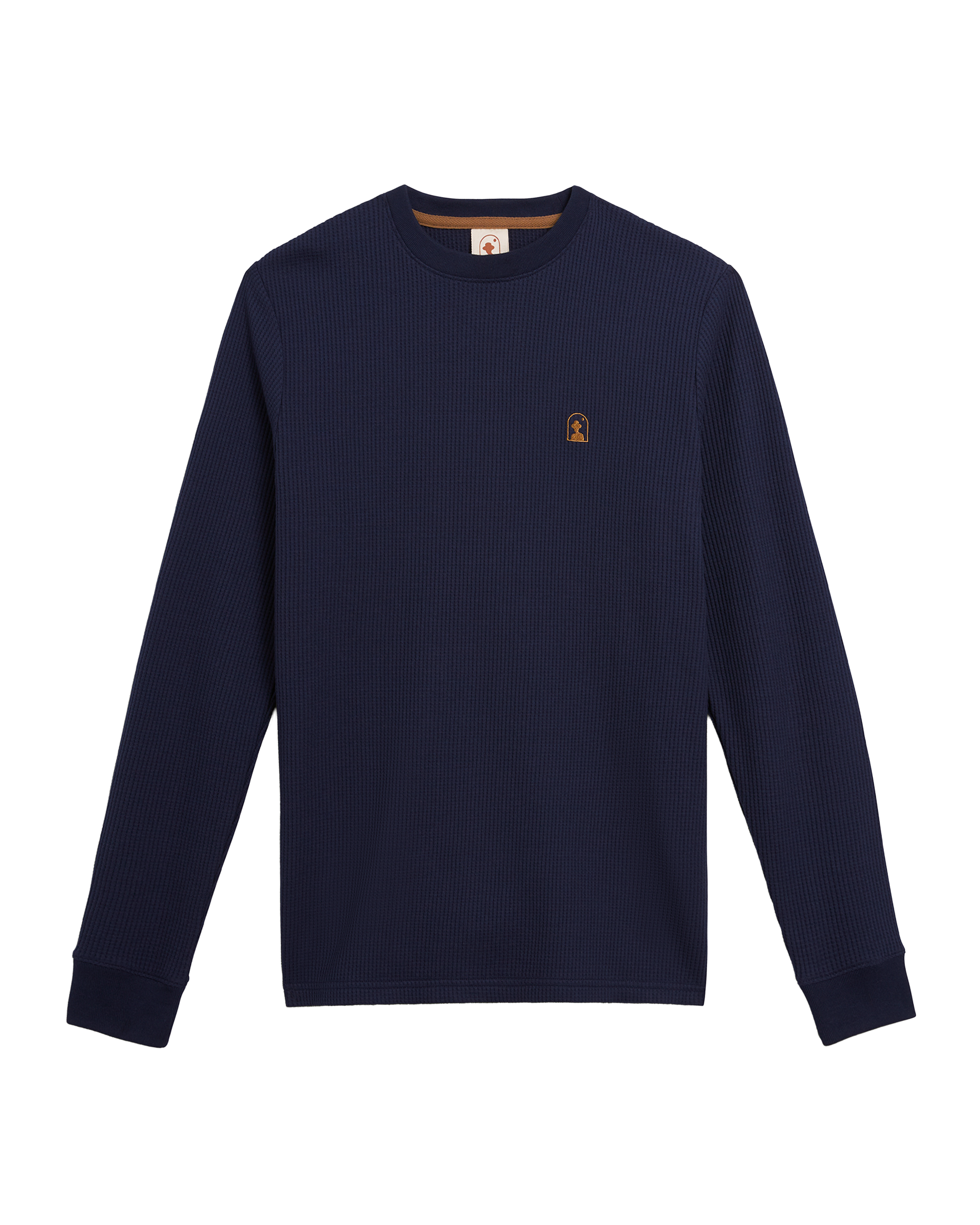 The Dandy Del Mar Cannes Long Sleeve Shirt in Luxe Navy, crafted from waffle knit fabric with a small brown embroidered logo on the left chest, is displayed flat on a white background.