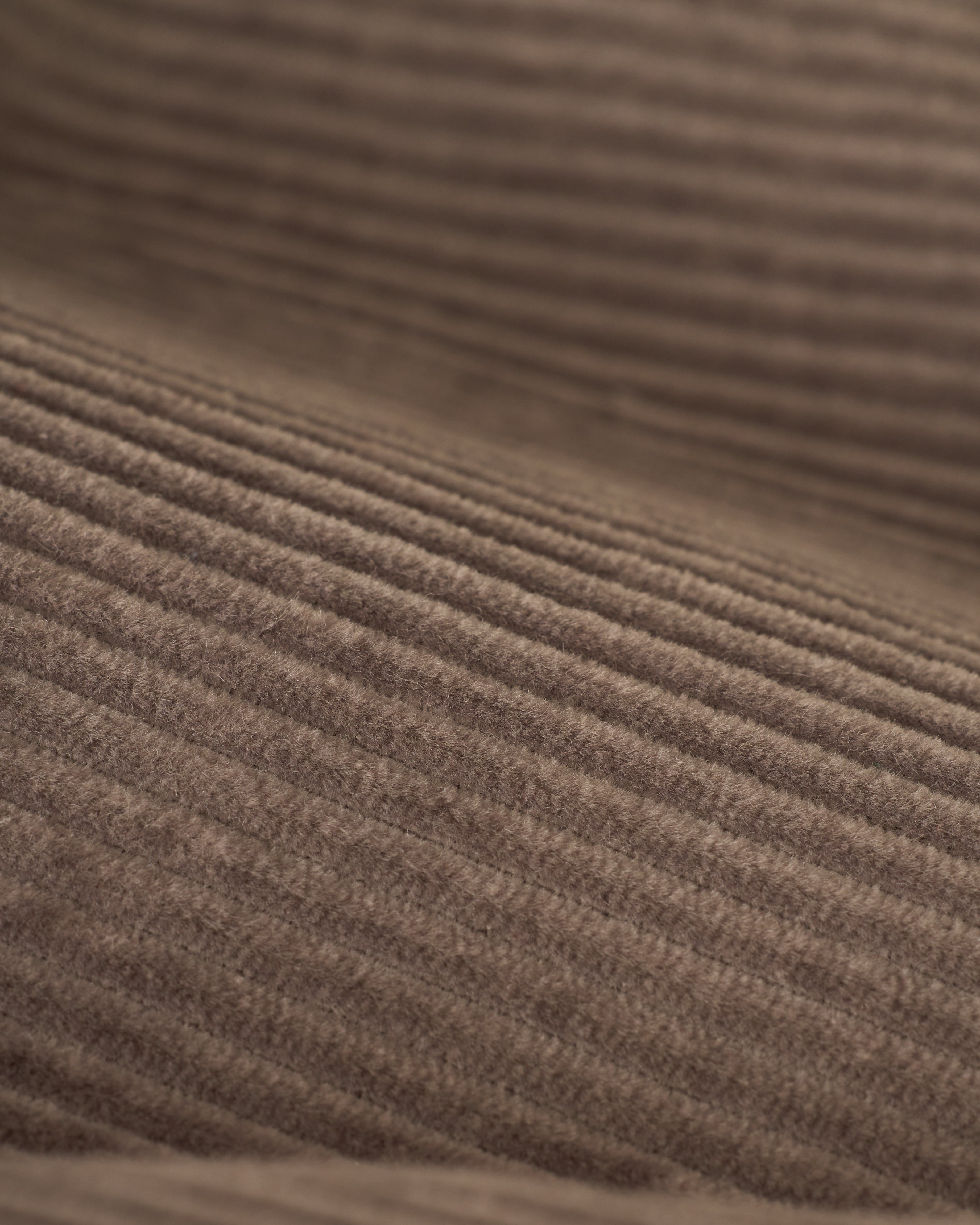 Close-up of The Corsica Corduroy Short - Argento by Dandy Del Mar, highlighting the brown corduroy fabric with its textured, ribbed pattern.
