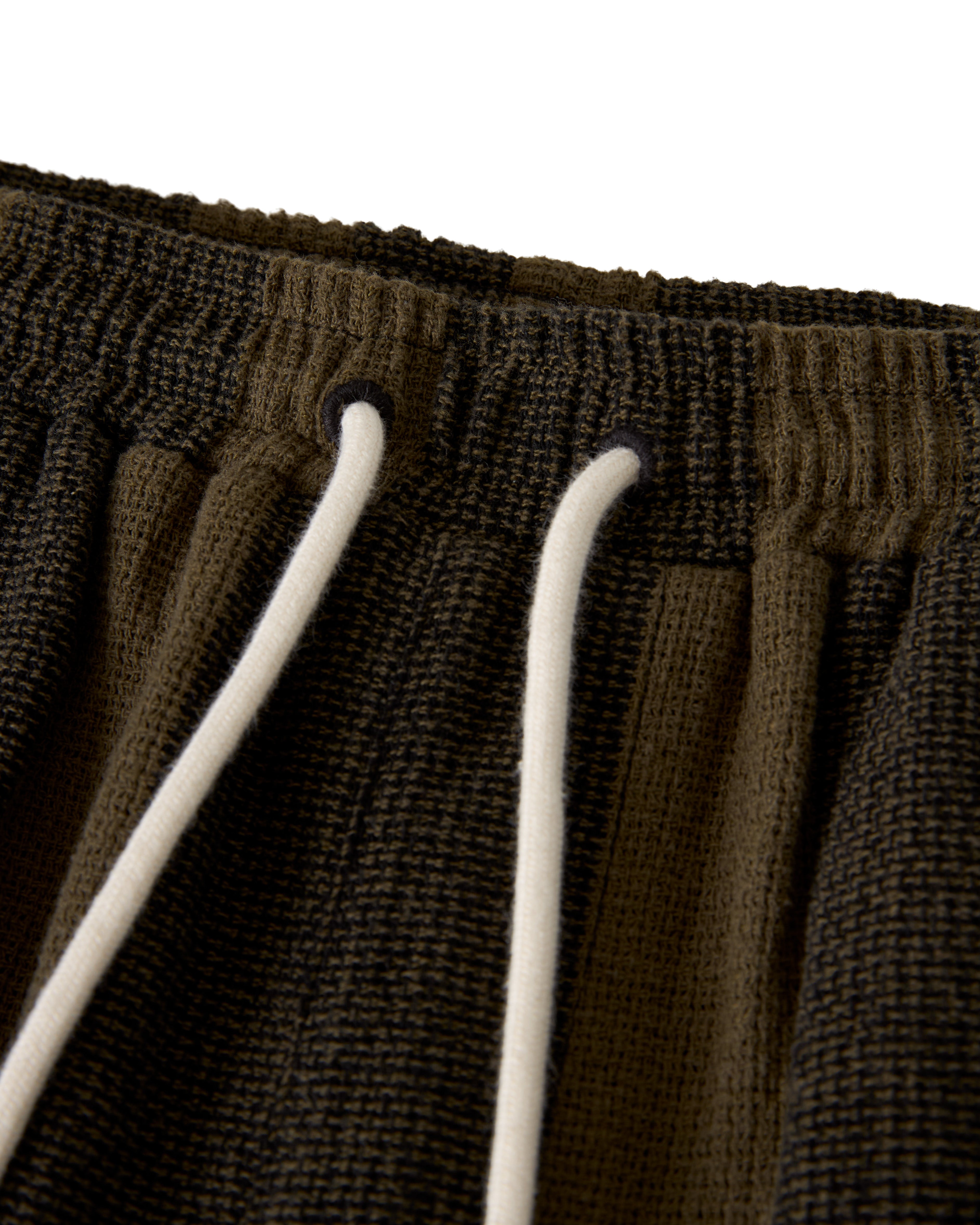 Close-up of The Palma Short - Onyx by Dandy Del Mar, featuring a brown textured design with an elastic waistband and white drawstrings.