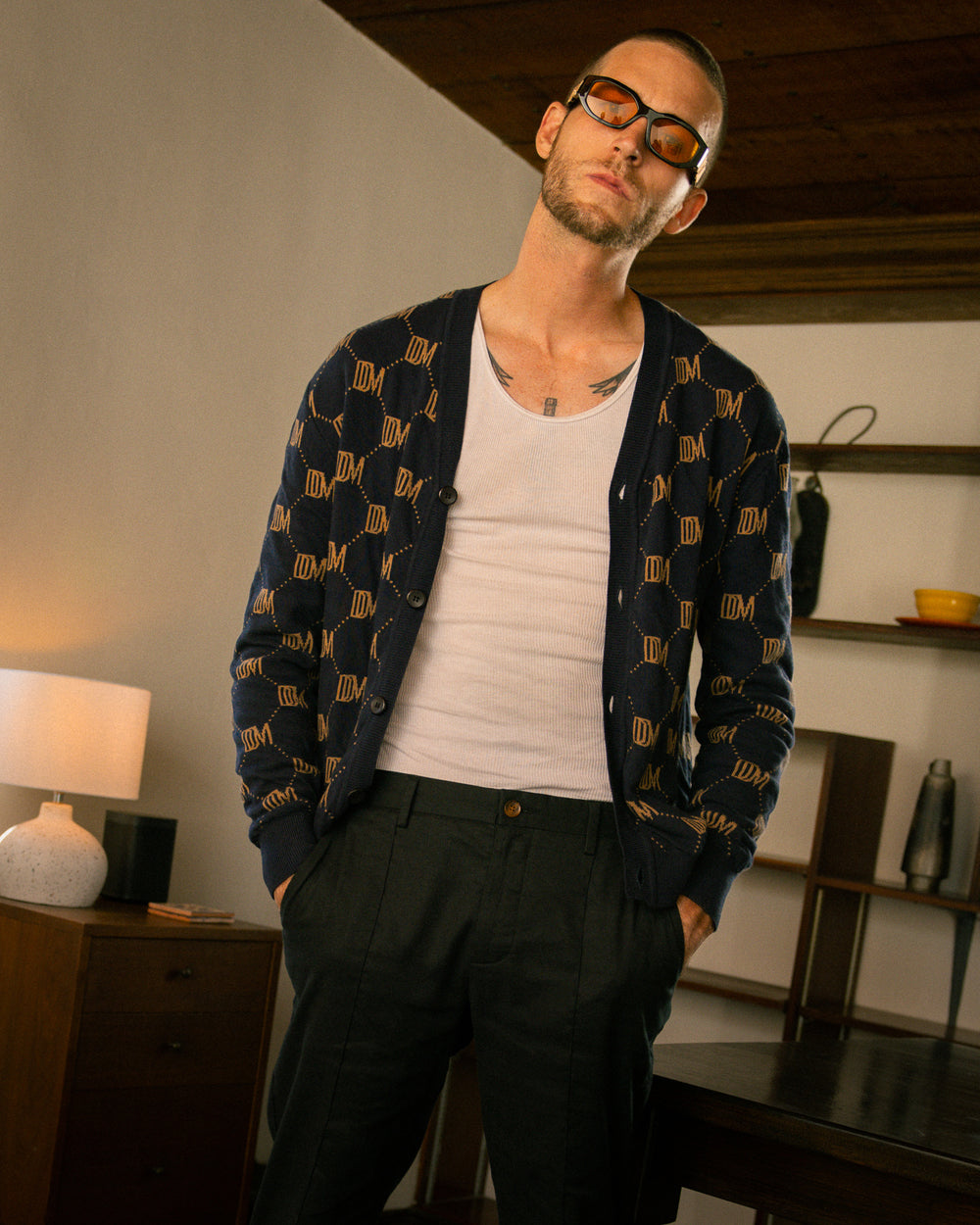 A man wearing glasses and The Castello Cardigan - Abyss by Dandy Del Mar.