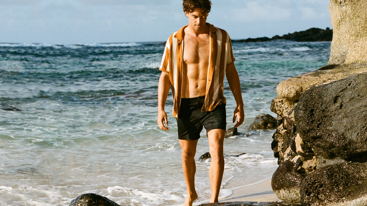 man by beach in dandy del mar shirt
