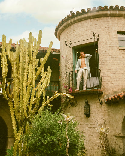 boy enjoying balcony view wearing dandy del shirt