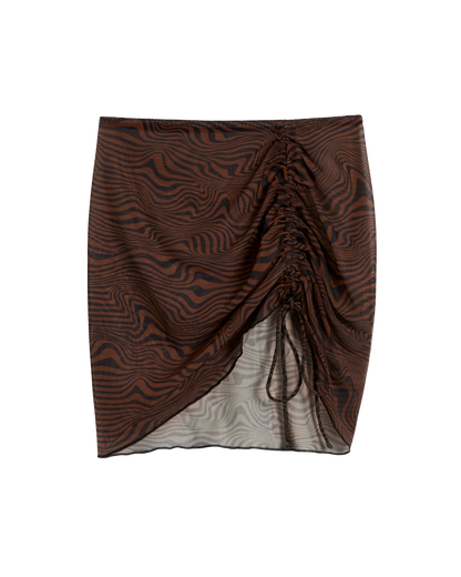 The Athena Skirt - Onyx by Dandy Del Mar is a mini with brown and black zebra print, ruched detailing, and a front drawstring—perfect for elevating your beach look.