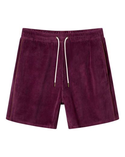The Rio Velour Short - Bordeaux by Dandy Del Mar features an elastic waistband, white drawstring, and side pockets in a rich burgundy velour, shown on a plain background.