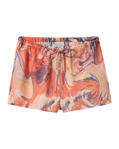 The Curacao Short - Lantana by Dandy Del Mar features an elastic waistband, adjustable drawstring, and a red, orange, and blue marbled pattern.
