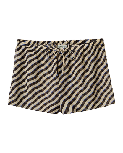 The Curacao Short - Tierra by Dandy Del Mar features a black, beige, and cream wavy stripe pattern, an elastic waistband, and a "Dandy" label on the waist.