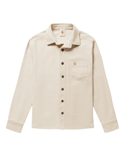 The Dandy Del Mar Corsica Corduroy Shirt in Alabaster White features a tailored relaxed fit, long sleeves, a front chest pocket, and dark buttons, shown laid flat on a plain background.