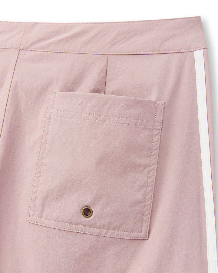 A pair of pink Stirata Swim Shorts - Rosado with a pocket on the side, made from performance fabric for optimal comfort and 4-way stretch for freedom of movement by Dandy Del Mar.