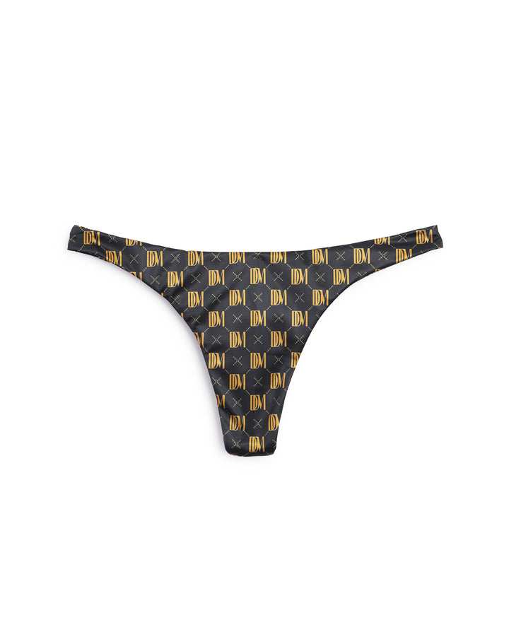 A black and gold checkered Gomera Bottom - Oro Monogram bikini bottom from Dandy Del Mar.