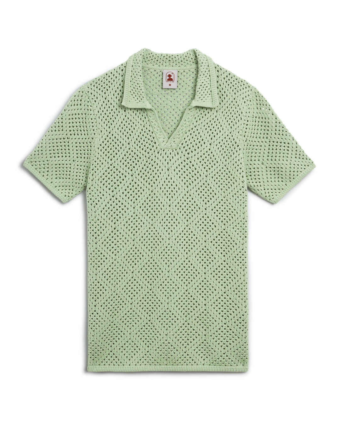 An Antibes Crochet Shirt - Pistachio, hand-crocheted, reminiscent of the vibrant greens found in the French Riviera by Dandy Del Mar.