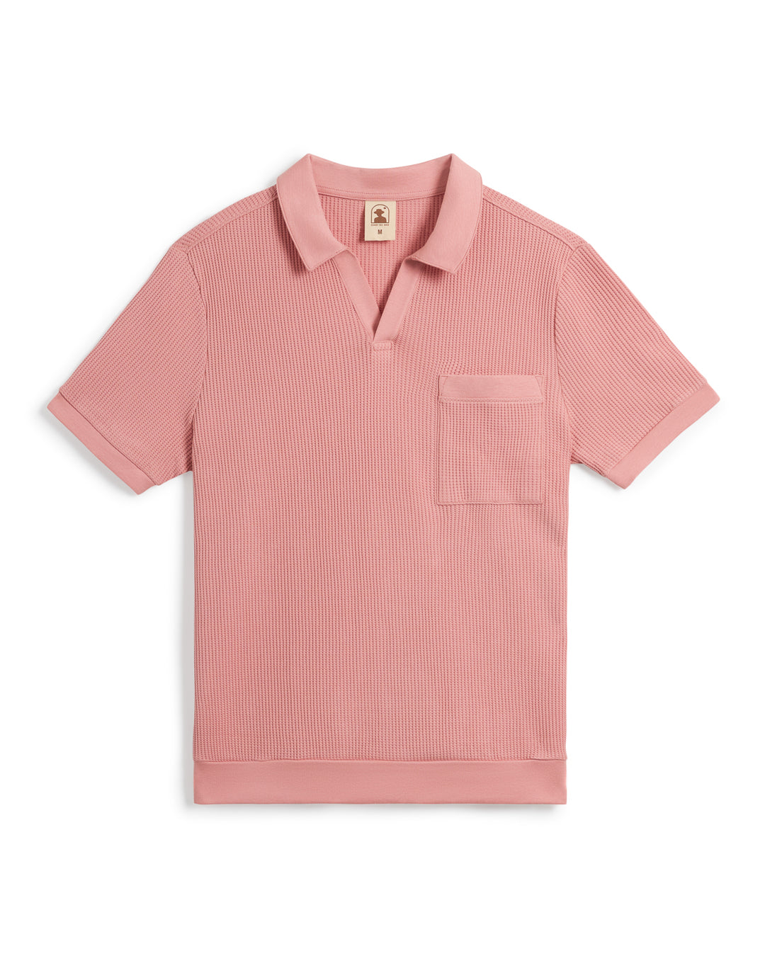 A pink short-sleeve The Cannes Waffle Knit Shirt - Spanish Rose from Dandy Del Mar with waffle knit fabric, a V-neckline, and a chest pocket.