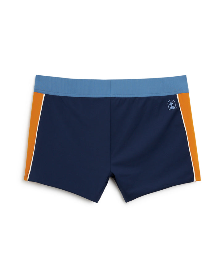 Elevate your beach or poolside style with the Dandy Del Mar Cassis Square Cut Swim Brief - Anchor. These men's swim trunks feature a striking blue and orange design that exudes leisurely vibes.