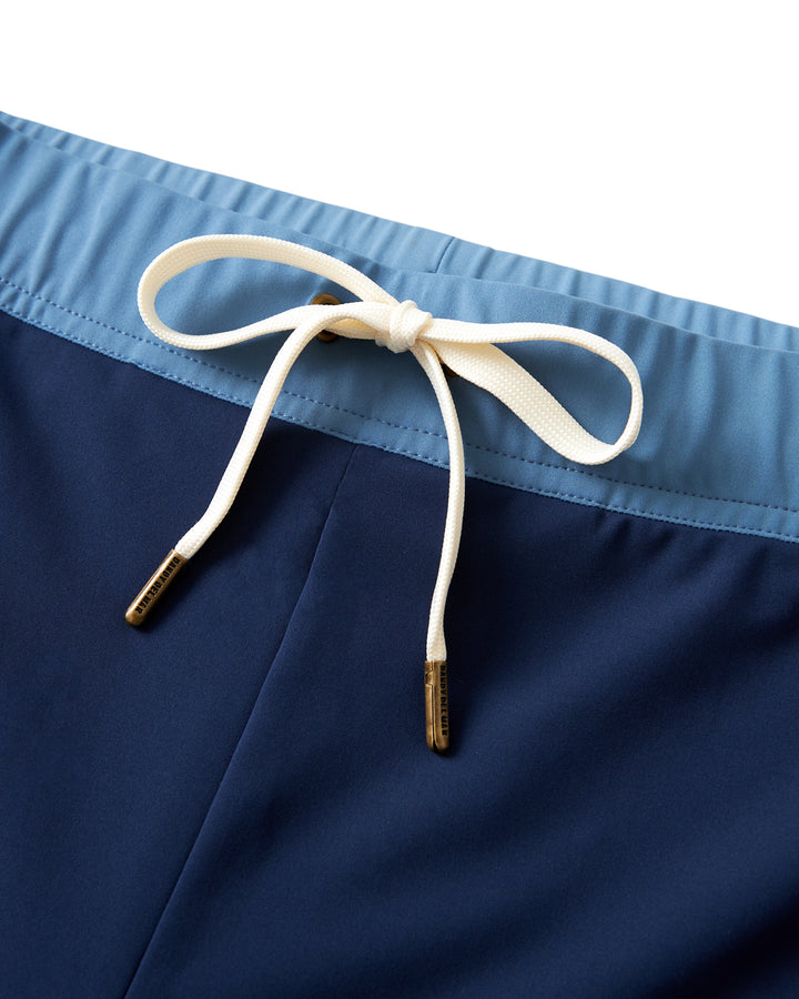 A pair of Dandy Del Mar Cassis Square Cut Swim Brief - Anchor with a gold belt, perfect for leisure and featuring a European fit.
