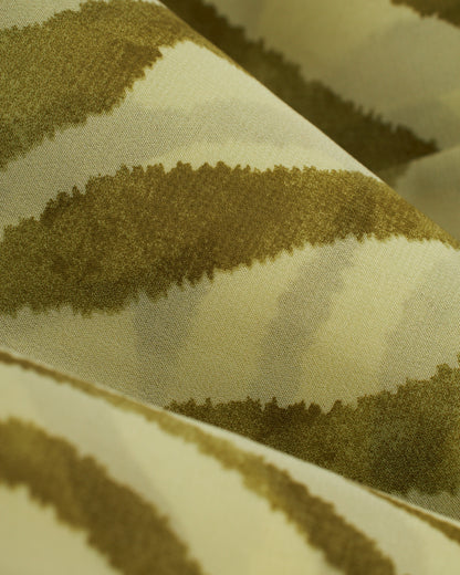 A close up of the Cayman Pants - Arbequina by Dandy Del Mar zebra print fabric.