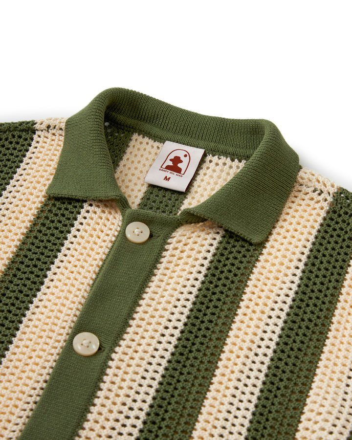A green and white striped crochet polo shirt, The Dominica Crochet Shirt - Arbequina, combining elegance and comfort by Dandy Del Mar.