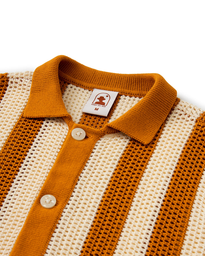 A close up of The Dominica Crochet Shirt - Burnt Sienna Stripe by Dandy Del Mar.