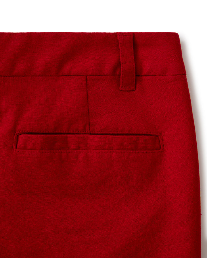 A close up of Dandy Del Mar's Florence Linen Skort - Pico, a pair of red chino pants.