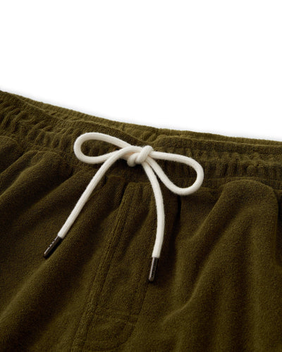 Close-up of the waistband of Dandy Del Mar’s The Gaucho Terry Cloth Shorts - Arbequina in olive green, featuring a white drawstring bow—an ideal blend of comfort and style for leisurewear.