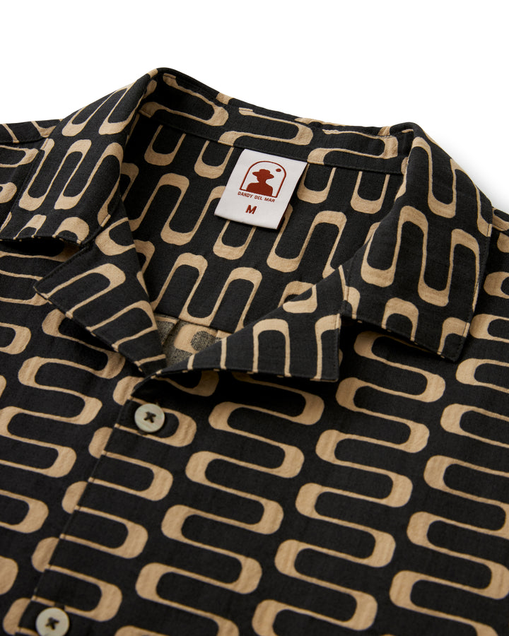 Product description: A lightweight black and tan Dandy Del Mar Truffle shirt with a geometric pattern.