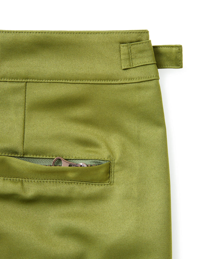 A pair of green Mallorca Swim-Walk Shorts with adjustable antique brass side fasteners from Dandy Del Mar.