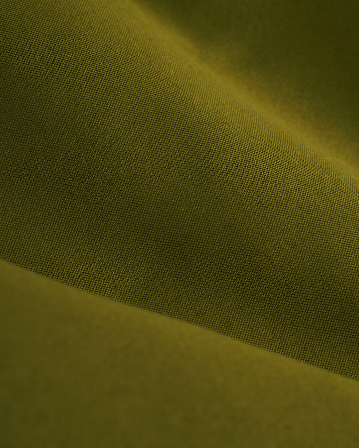 A close up image of a green Mallorca Swim-Walk Short fabric by Dandy Del Mar.