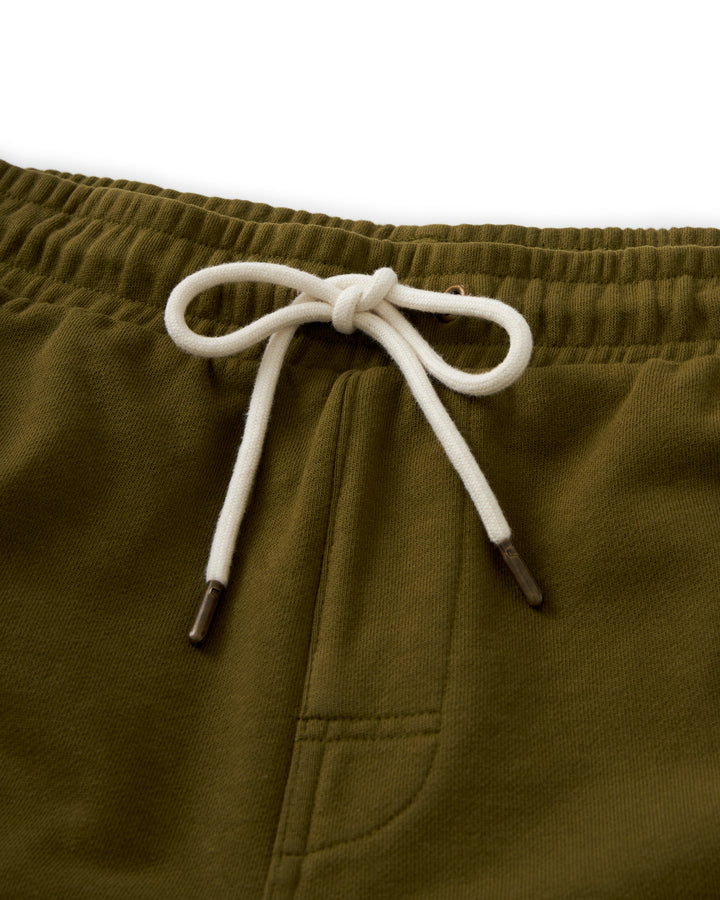 A pair of Dandy Del Mar's Marseille shorts in Arbequina, featuring a white drawstring.