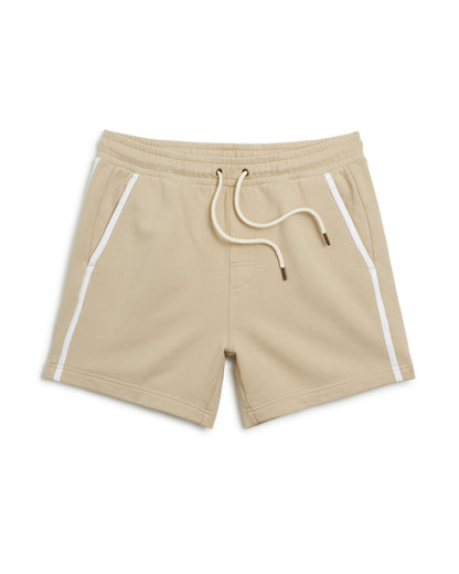 The Marseille French Terry Short in ginger by Dandy Del Mar showcases an elastic waistband, white drawstrings, and side pockets with white piping accents, crafted from soft French terry for ultimate comfort.