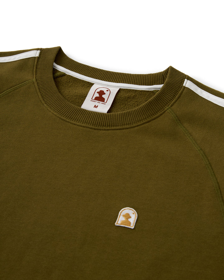 A green Dandy Del Mar Marseille Pullover sweatshirt with a white logo on it.