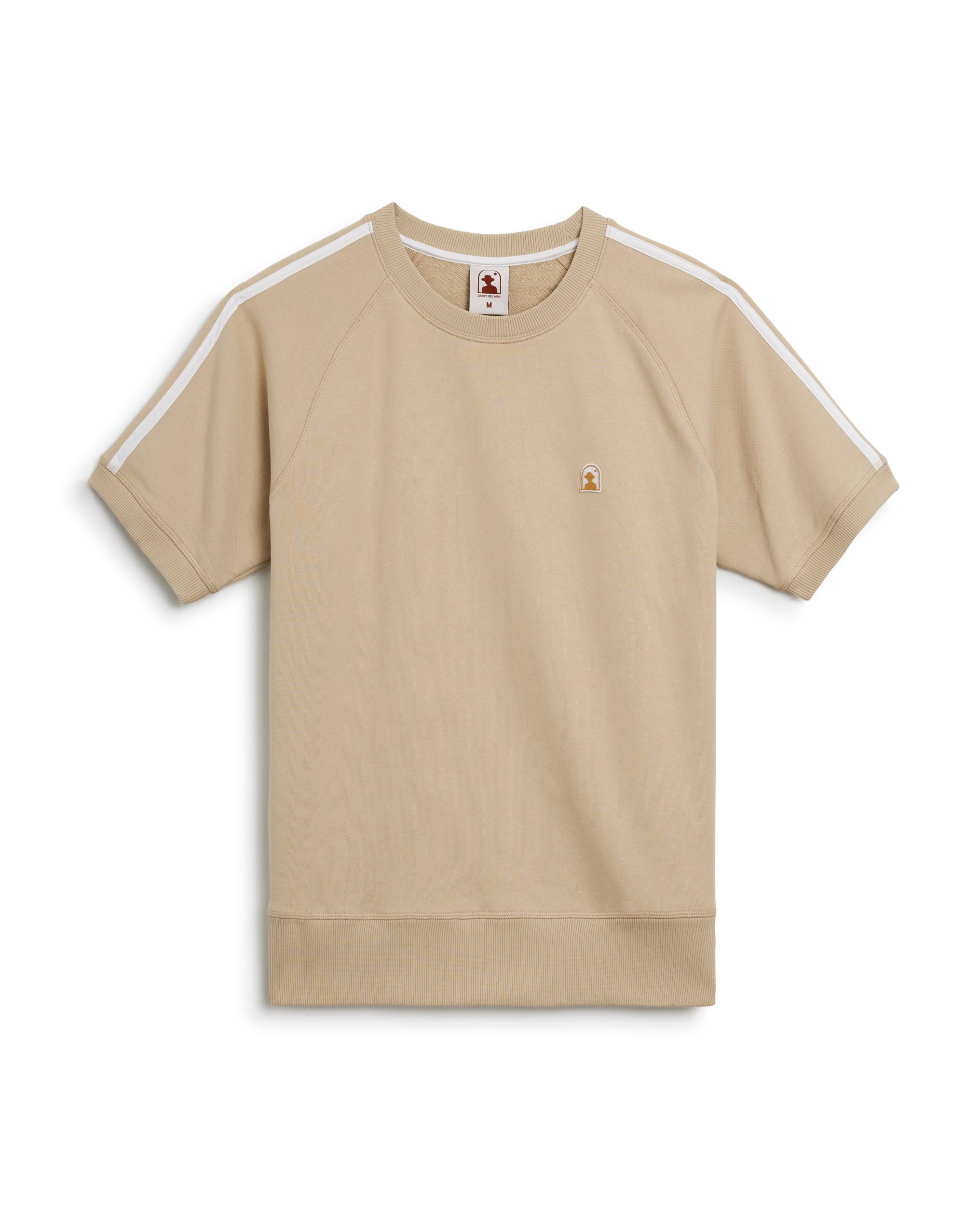 A beige, short-sleeved French Terry Pullover with white stripes on the shoulders, featuring a small embroidered logo on the chest, called The Marseille French Terry Pullover - Ginger by Dandy Del Mar.