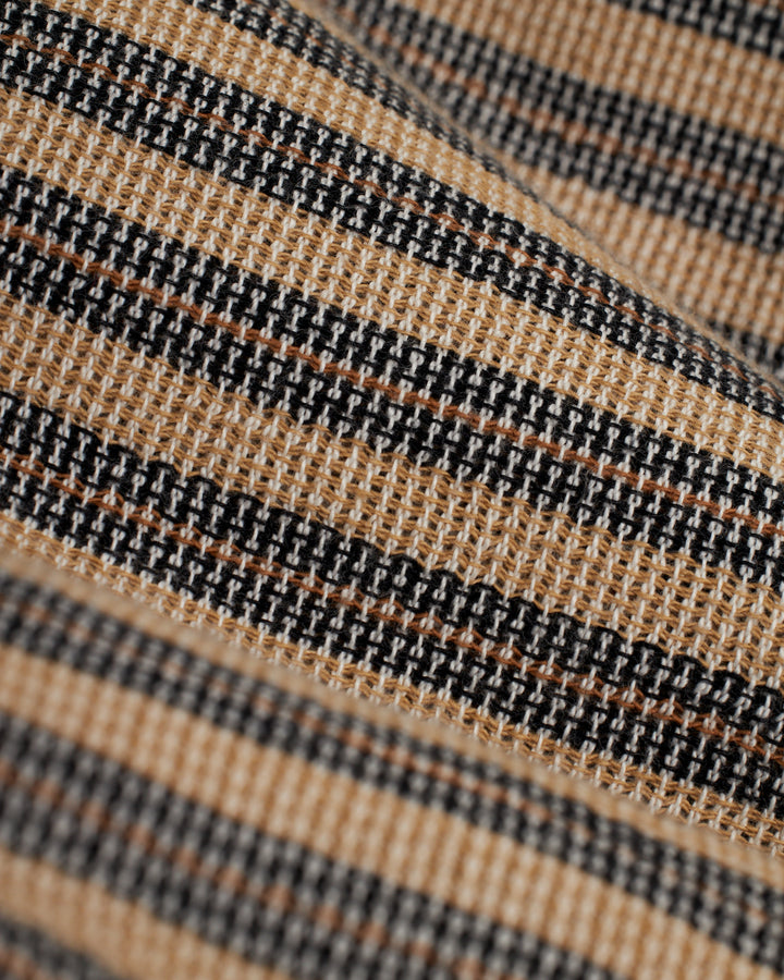 A close up of The Palma Shirt - Cacao Stripe, a striped fabric by Dandy Del Mar.