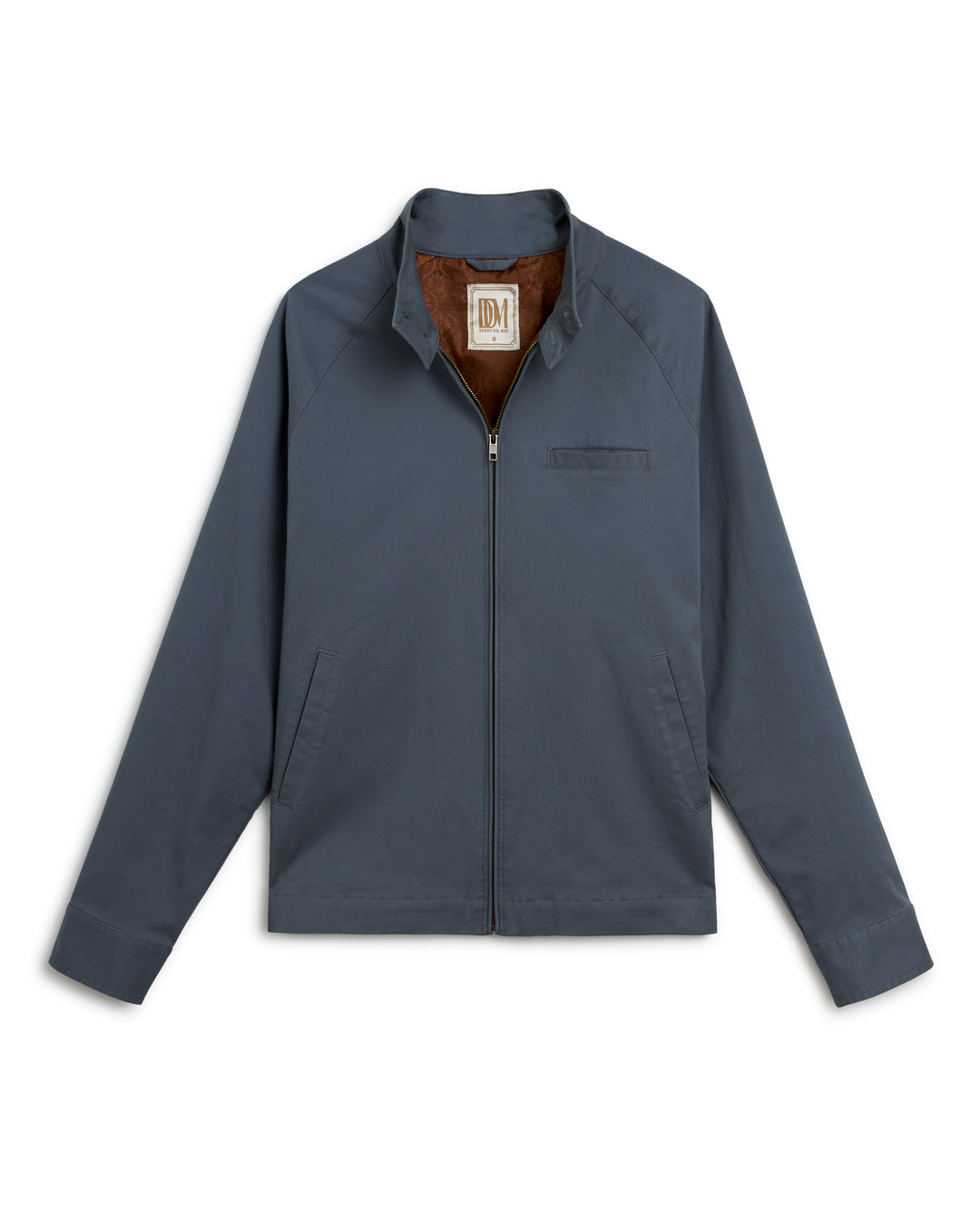 The Abyss Rhodes Jacket by Dandy Del Mar, a men's blue jacket with a brown lining, is made of washed cotton twill fabric, offering a lightweight shell.