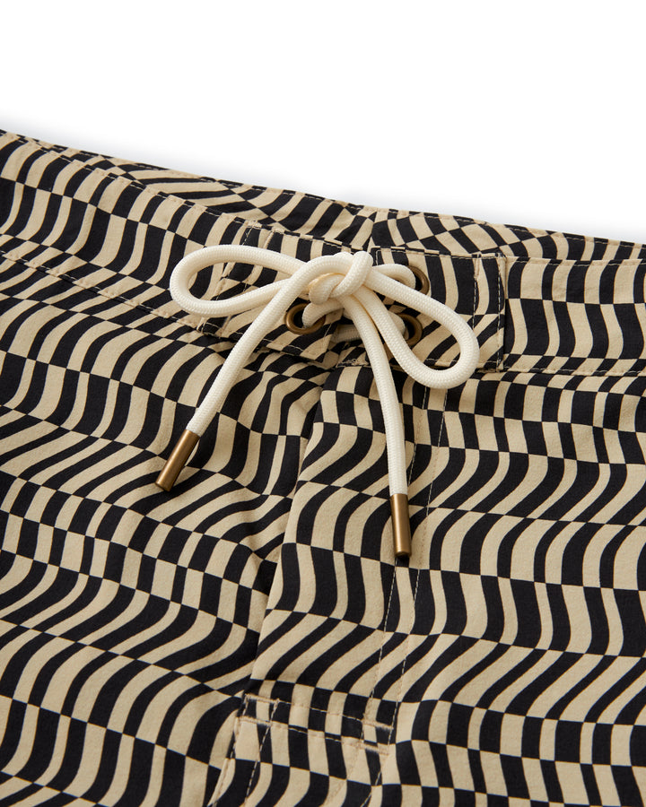 A water-resistant The Stirata Swim Short - Albatross with black and white stripes by Dandy Del Mar.