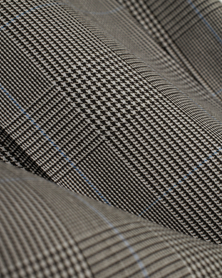 A close up of a black and blue checkered Dandy Del Mar Tresco Trouser - Albatross with a relaxed fit trouser.
