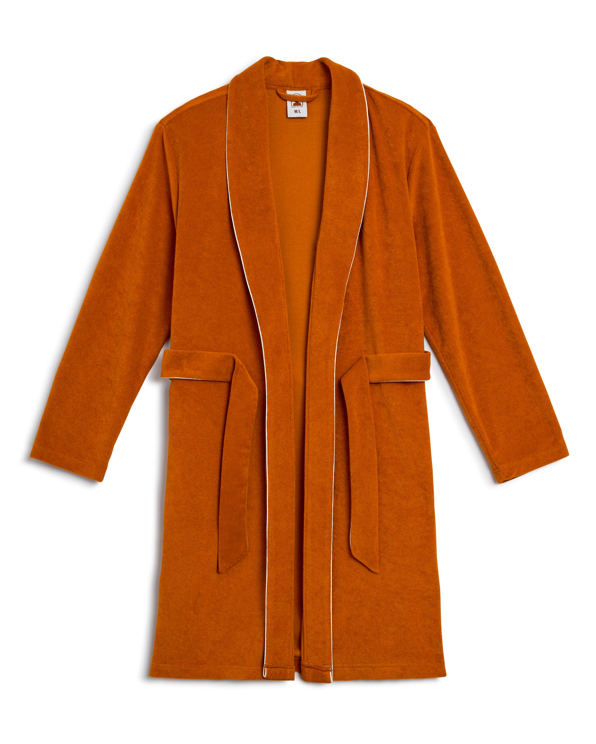 The Tropez Robe by Dandy Del Mar in Burnt Sienna is ultra-soft Terry Cloth with white piping, featuring a shawl collar, long sleeves, and a waist belt. Its above-the-knee fit adds a modern touch to your lounging experience.