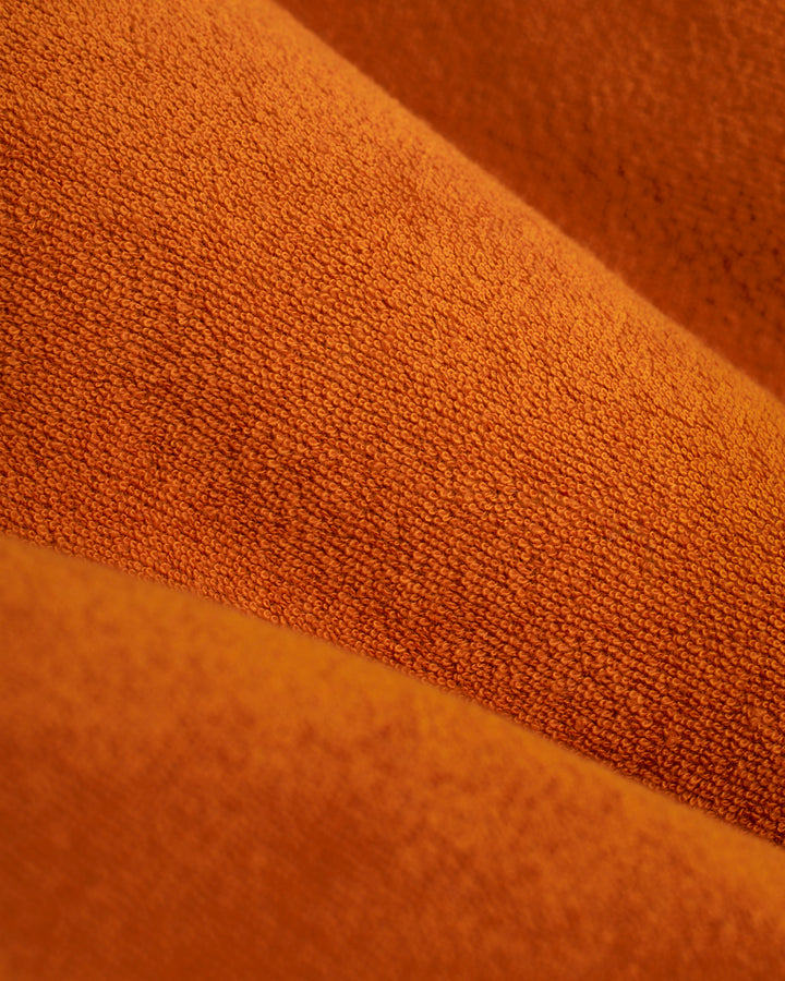 An above-the-knee fit image of The Tropez Robe - Burnt Sienna by Dandy Del Mar fabric.