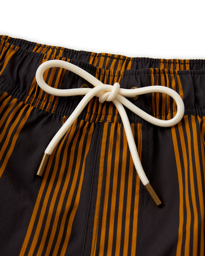 A pair of Dandy Del Mar Ventura Volley Short - Albatross orange and black striped swim trunks.