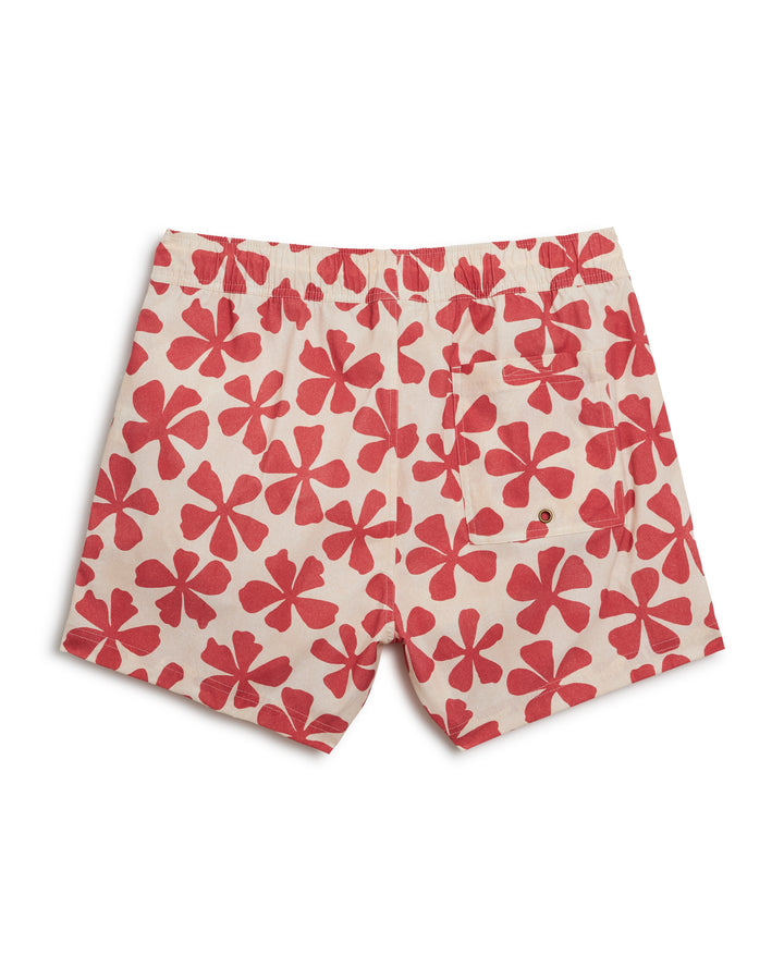A Dandy Del Mar Ventura Volley Short - Currant with red and white flowers on it.