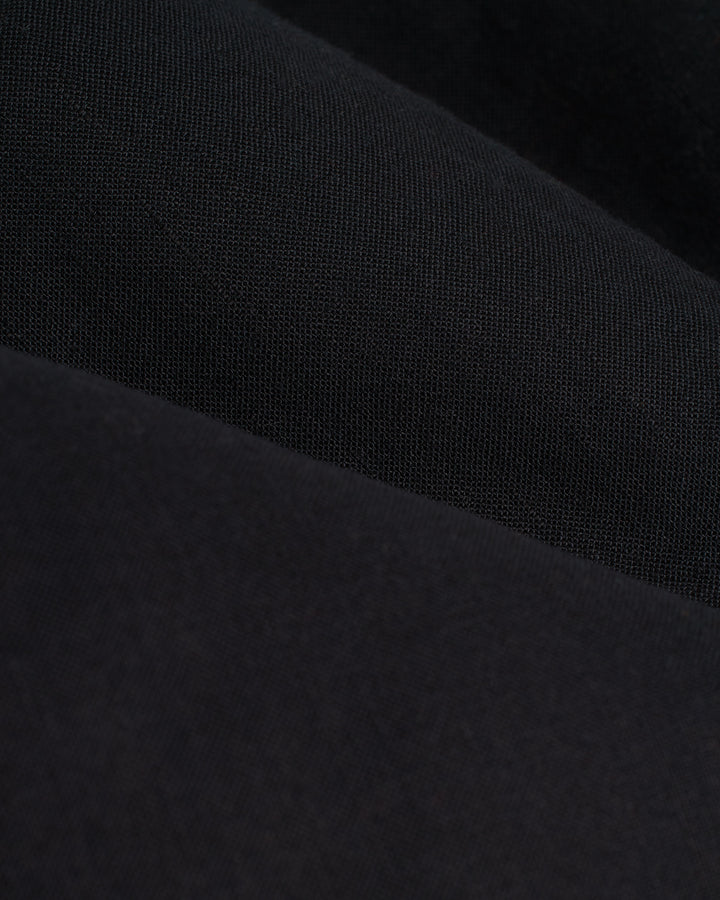 A close-up of the Dandy Del Mar Brisa Linen Trouser - Onyx.
