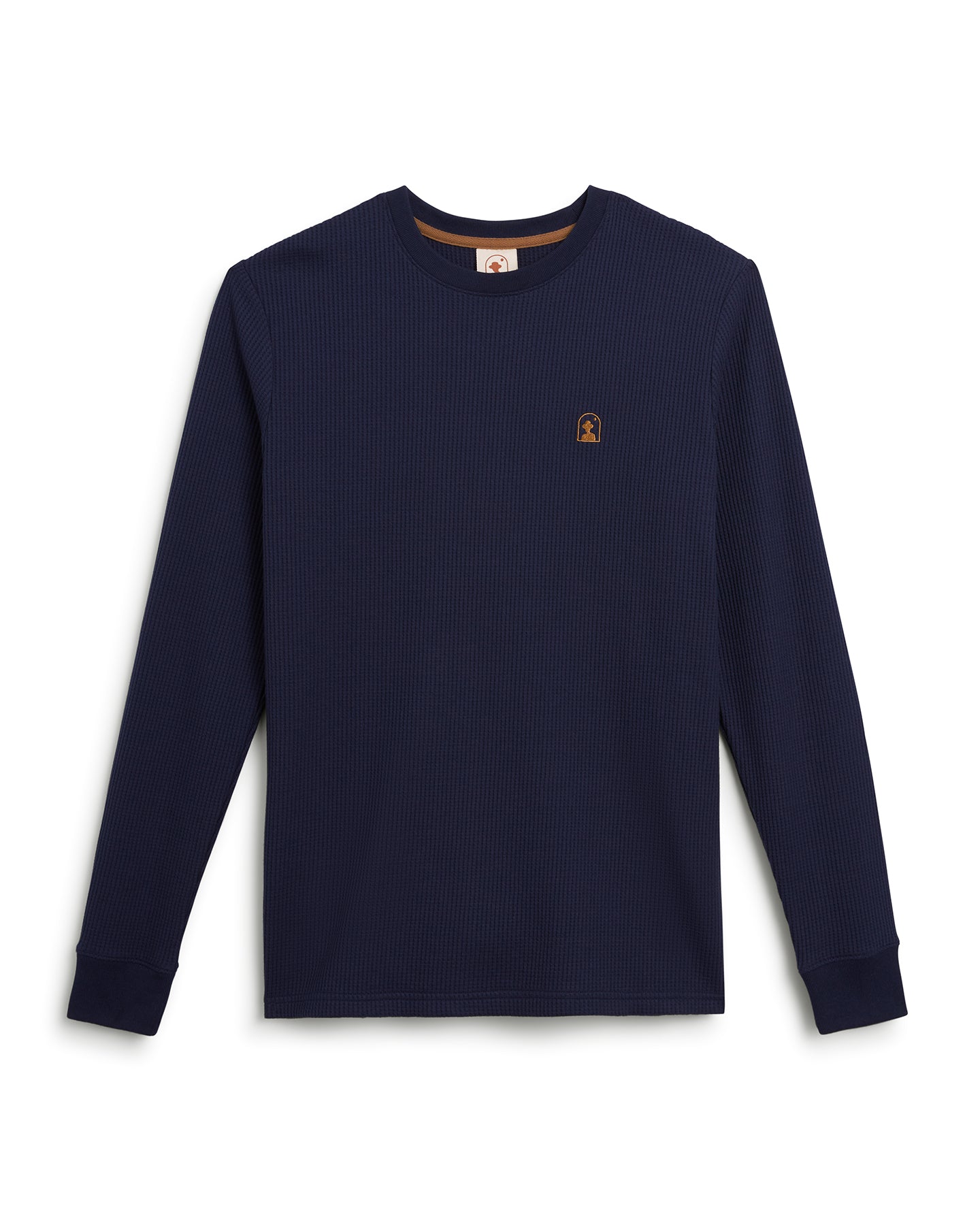 This is The Cannes Long Sleeve Shirt - Luxe Navy from Dandy Del Mar, featuring a small brown embroidered logo on the left chest and ribbed cuffs.