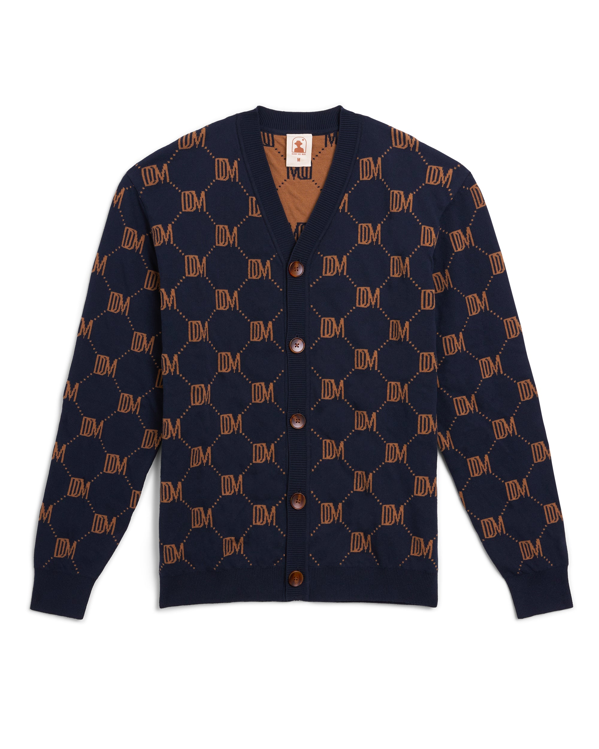 A navy and brown Castello Cardigan - Abyss by Dandy Del Mar with a monogram on it, perfect for the dandy aesthetic.