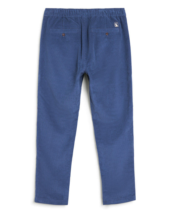 A boy's blue Corsica Pant by Dandy Del Mar with buttons and pockets.