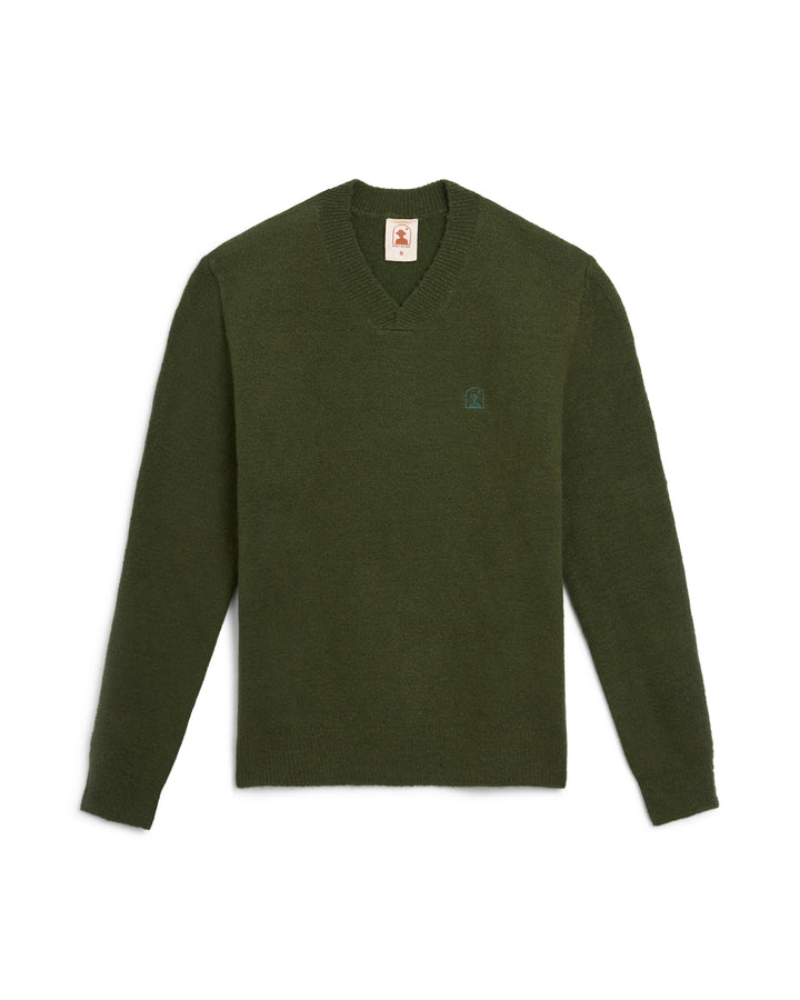 The Lima Sweater - Selva by Dandy Del Mar is a fashionable long sleeve sweater in green, featuring a unique logo, ideal for any occasion.