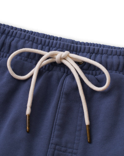 Close-up of The Marseille French Terry Shorts - Moontide by Dandy Del Mar, featuring a soft elastic waistband with a white drawstring tied in a bow and finished with metal aglets.