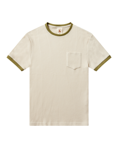 The Cannes Waffle Knit Tee - Vintage Ivory by Dandy Del Mar features short sleeves, ribbed waffle knit fabric, olive green contrast collar and sleeve trim, plus a left chest pocket, shown on a black background.