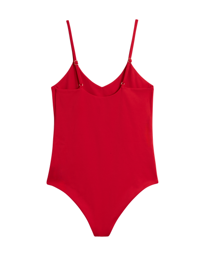 The Deia One Piece - Pico by Dandy Del Mar is a red swimsuit featuring thin adjustable shoulder straps and a flattering high-cut design, showcased on a plain background.